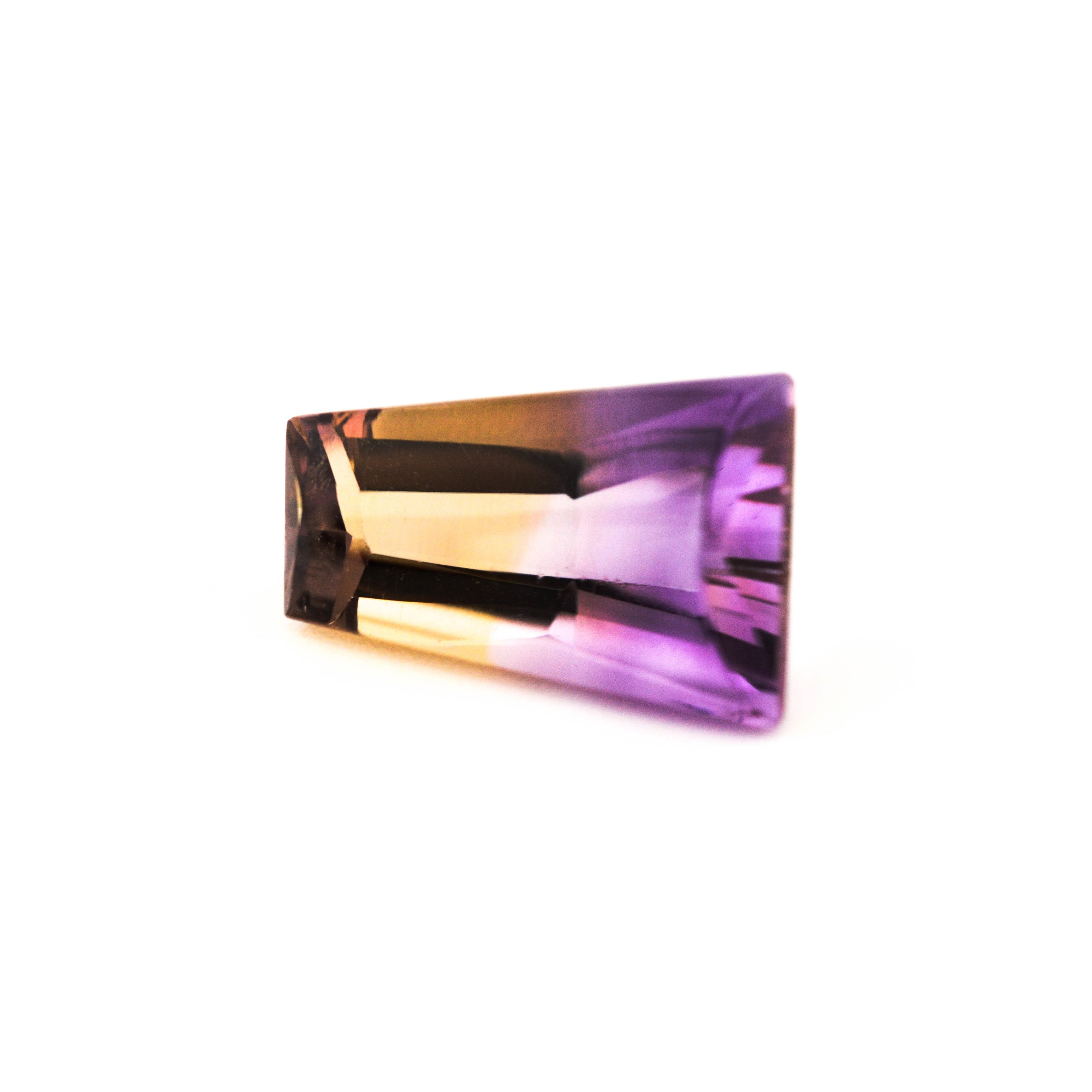 Multicolored gemstone on a white background