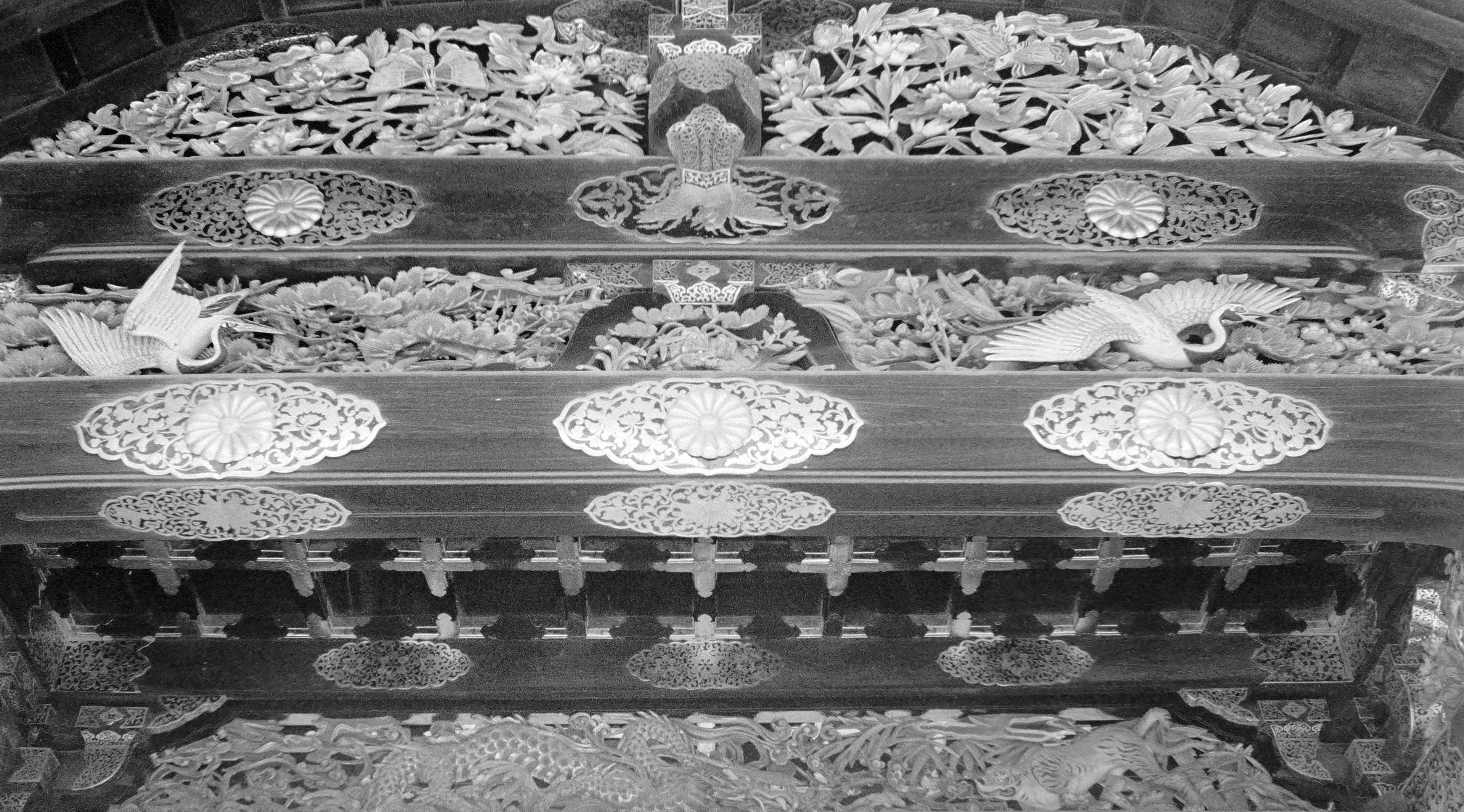Decorative wooden panel with intricate carvings and patterns