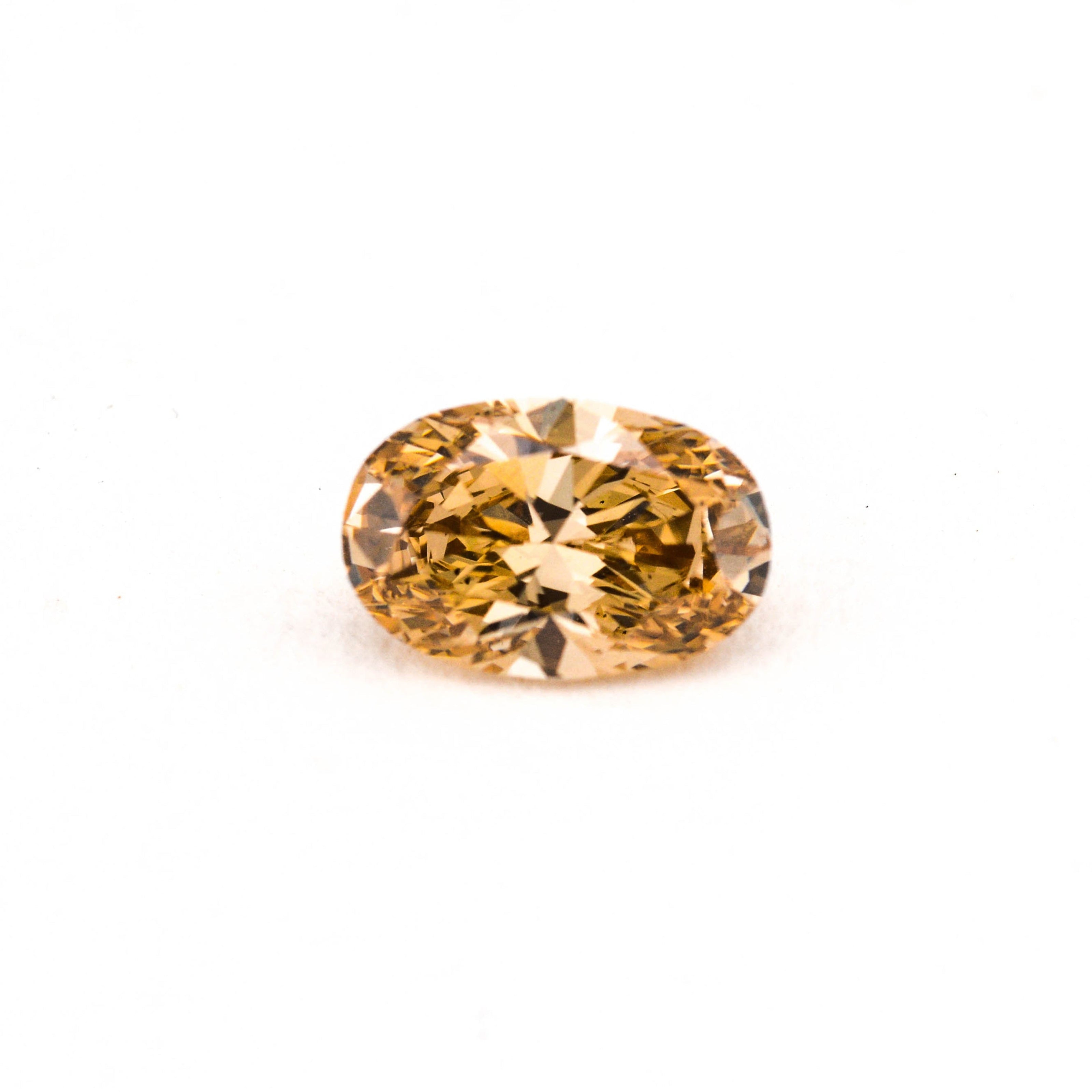 Yellow gemstone on a white background